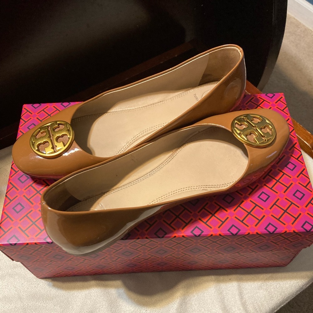 Tory Burch patent leather flats with gold detailing and shoe/garment bag